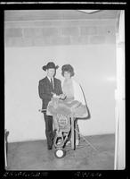 Johnny &  Betty Hawkins with saddle