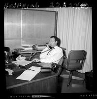 Lex Connelly at desk