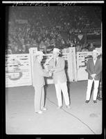 Don McLaughlin and Gov. Love  (buckle) in arena