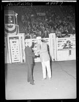 Bill Kornell and Gov. Love (buckle) in arena