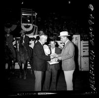 James Bynum and Gov. Love (buckle) (Trailer man in background in arena)