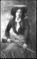 Wishing You a Merry Christmas [Cowgirl with cowboy hat, neckerchief, and rifle]