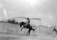 [Unidentified Cowboy riding bronc]