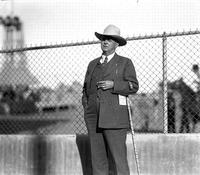 [Unidentified elderly man in 3-piece suit, western hat, and cane]