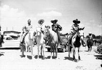 [Possibly Turk Greenough, Sally Rand, & Margie & Alice Greenough on horses]
