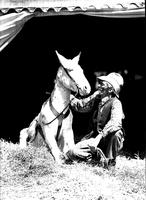 [Unidentified rodeo clown posed with his mule]