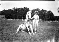 [Mamie Francis standing beside a sitting Christmas]