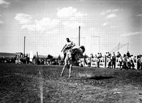 [Unidentified Cowboy riding bronc]