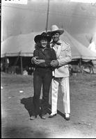 [Autry in suit with longhaired, unidentified cowgirl, Aquatennial Rodeo Minneapolis, Minn.]