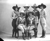 [Six cowgirls posed in studio]