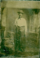 Cowboy with chaps and six-gun