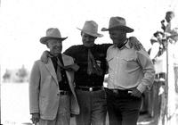 [Cremer & two unidentified men; one in a suit, the other a cowboy]