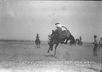 Tuffy Combs on "Tip Top" Burwell Rodeo