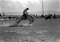 Ray Mavity on "Klu Klux" Sheridan, Wyo Rodeo