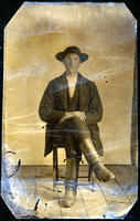 Man with hat and tall boots