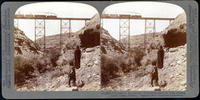 A wonder to the primitive inhabitants - Santa Fe train crossing Canyon Diable, Arizona