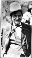 [Medium shot of Will Rogers wearing hat and bow tie]