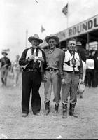 [Three unidentified western attired cowboys, two with ties, one a director of rodeo]