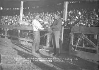 Geo. Baer Presenting the Roosevelt Trophy to Bob Crosby the 1925 and 1928 winner