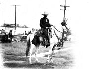 [Unidentified cowboy on Pinto; decorative breast collar on horse]
