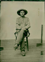 Seated farmer with hat
