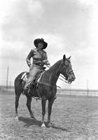 [Possibly Grace White posed atop horse]