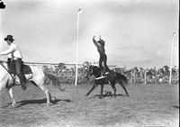 [Unidentified Cowgirl doing Hippodrome stand with hands overhead]