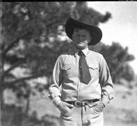 [Leo J. Cremer in necktie and western hat]