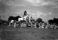 [Possibly Ray Ramsey & Flying Clouds doing Roman Stand jump over hurdles]