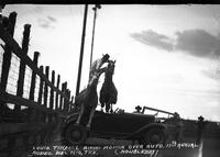 Louis Tindall Riding Roman Over Auto 11th Annual Rodeo, Del Rio, Tex.