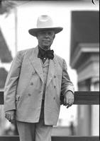 [Unidentified elderly man in suit, western hat, and large bow tie]