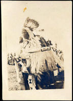 Blackfeet Indian in headdress at tribal gathering