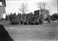 [Group of Military personnel in coats; with them is a woman]