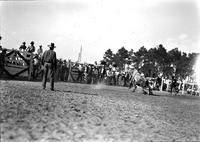 [Unidentified Cowboy headed face first in to the dirt after leaving bareback bronc]