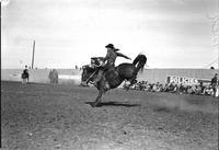 [Unidentified Cowboy riding bronc]