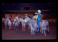 Unidentified group of contestants on horseback