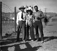 [Possibly Will James stands with unidentified cowgirl and cowboy]