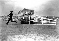 [Kid Roberts leading the Steer "Storm City" to jump over automobile]