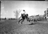 [Bill McMacken riding an airborne "Holy Smoke']