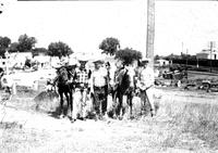 [Wild Bill Elliott with possibly Leo Cremer and Montie Montana and three horses]