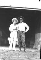 [Unidentified cowboy and possibly Lucyle Richards with double horseshoe pin on scarf]