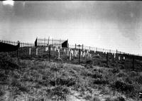 [Wrought Iron fence-enclosed cemetery]