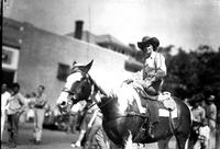 [Possibly Vivian White sitting sidesaddle on stationary horse]