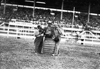 [Jasbo Fulkerson, Ray Talbot in barrel, & George Mills]