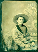 Man with fancy clothing and large cowboy hat