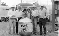 Group at Rodeo clown Quail Dobbs' barrel