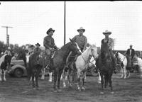 [Possibly Eddie Curtis and two unidentified cowboys on horseback]