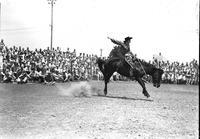 [Possibly Mary Parks riding bronc]