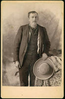 Tom Purley [Man holding cowboy hat]