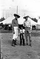 [Autry with unidentified little boy and man with butterflies on shirt]